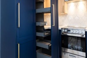 Modern kitchen with navy blue cabinets